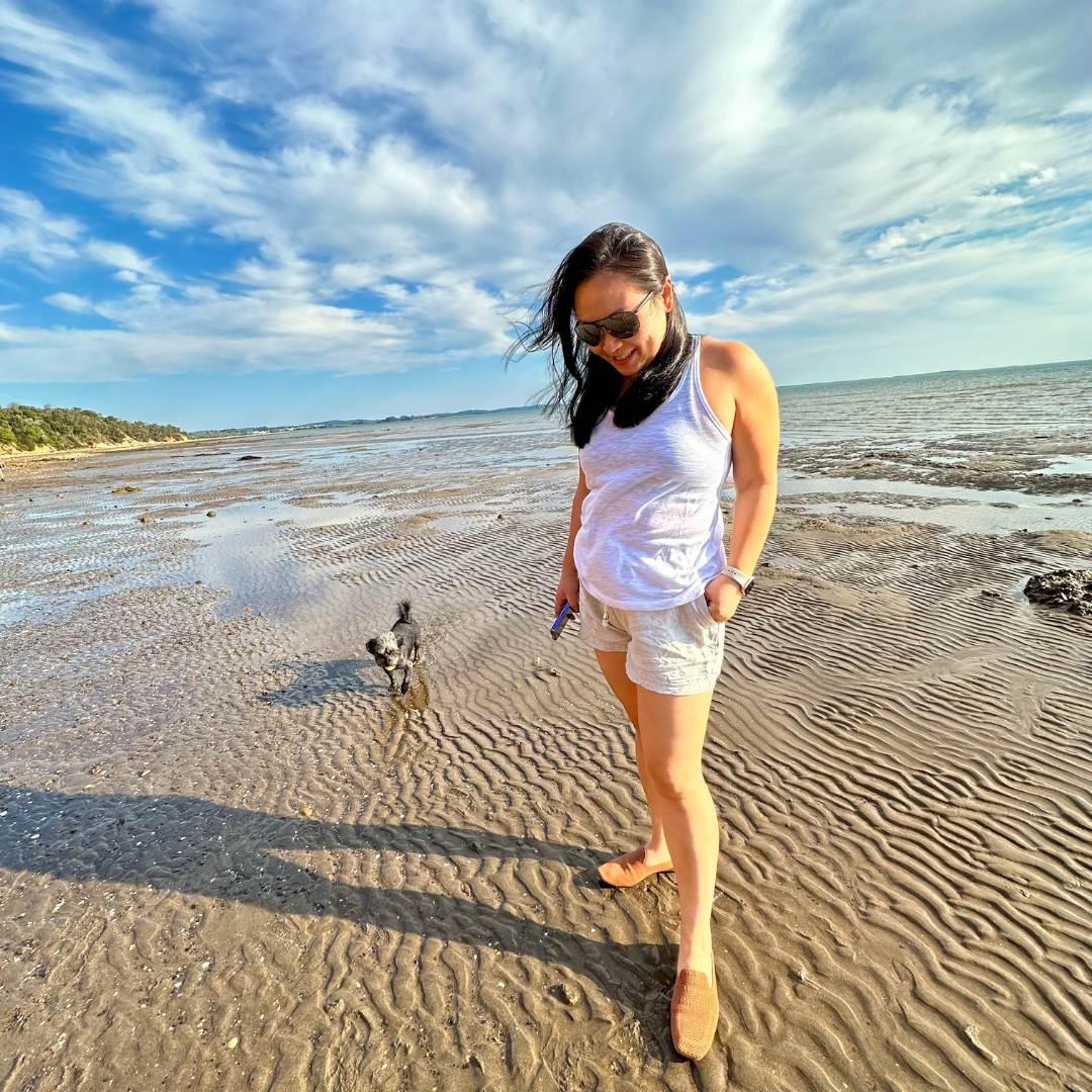 aciae sustainable footwear founder Tina on a clean beach